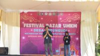 Ketua Pelaksana, Firnanda Aldi Pujangga saat menyampaikan sambutannya dalam Festival Bazar, Minggu (21/7/2024). (doc. KKN-BBK 4 Unair Desa Kedungundi) Ketua Pelaksana, Firnanda Aldi Pujangga saat menyampaikan sambutannya dalam Festival Bazar, Minggu (21/7/2024). (doc. KKN-BBK 4 Unair Desa Kedungundi)