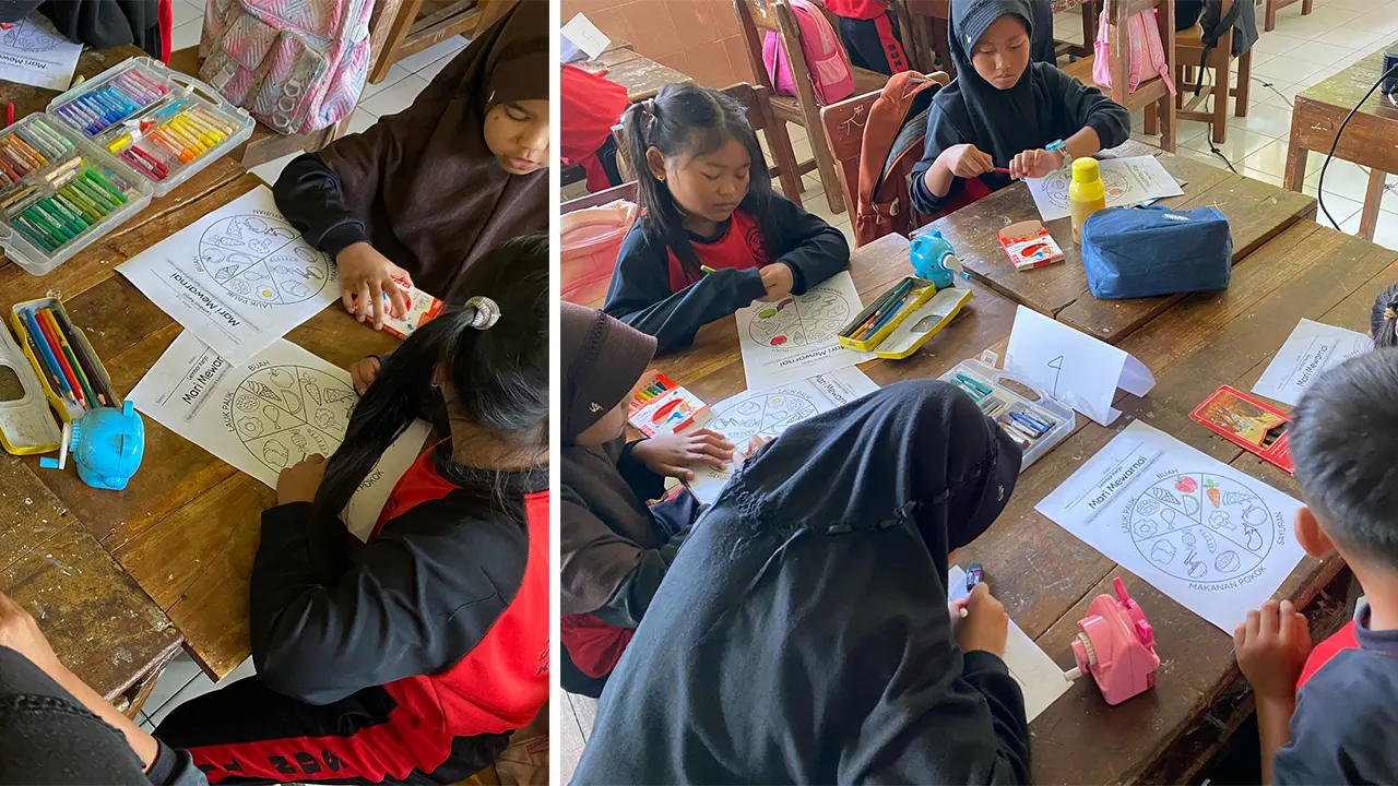 Antusias para siswa saat sesi mewarnai gambar makanan sesuai panduan Isi Piringku. (doc. KKN 344 UNS)